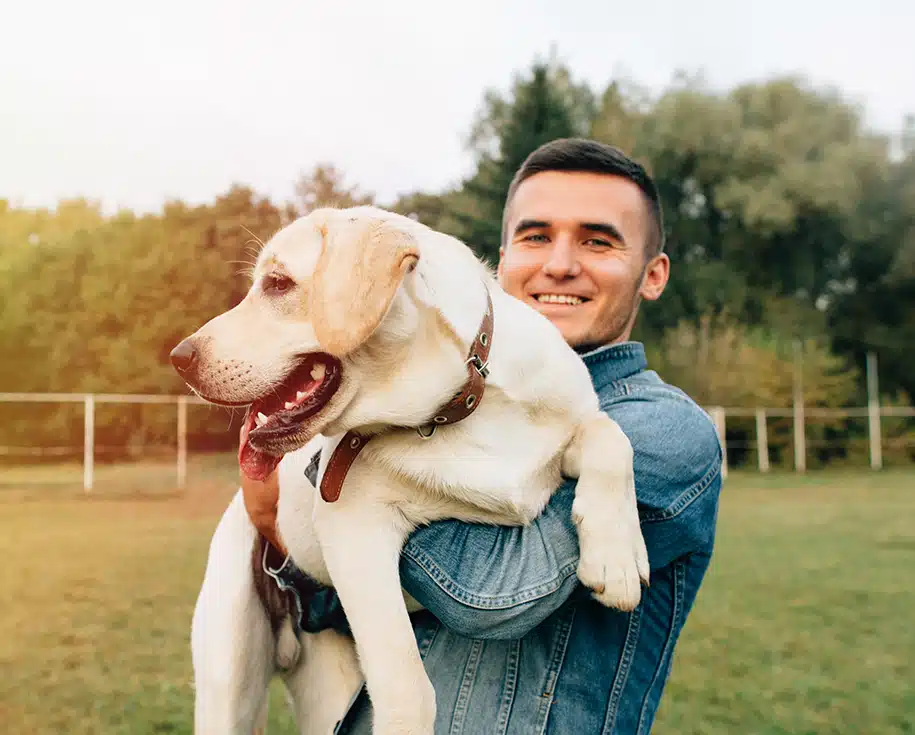 Dog Walking in Jacksonville, FL | Lucky Dog Pet Care Lucky Dog Pet Care dog walker holding a leashed dog in a Jacksonville, Florida neighborhood